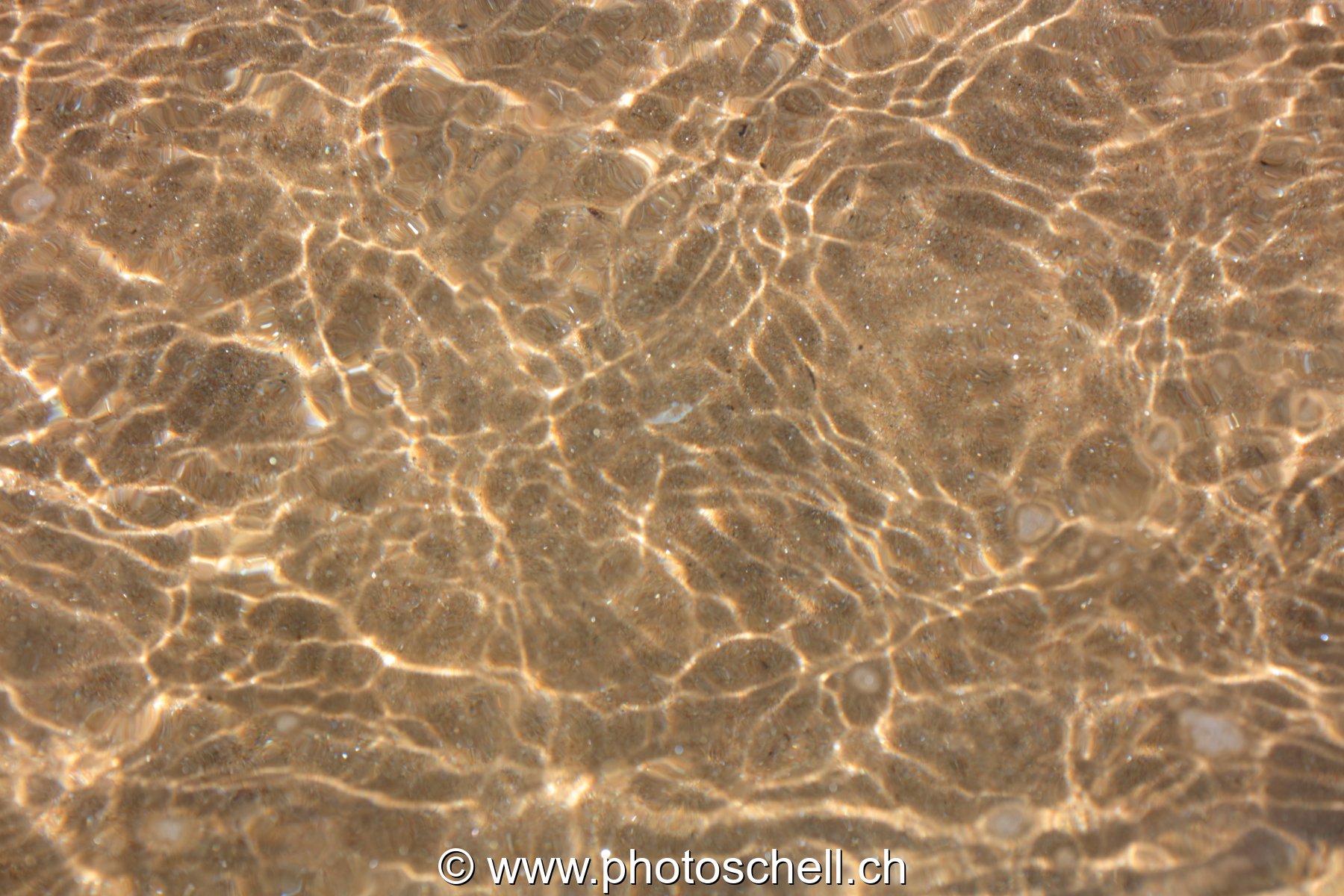 Reflets sur le sable
