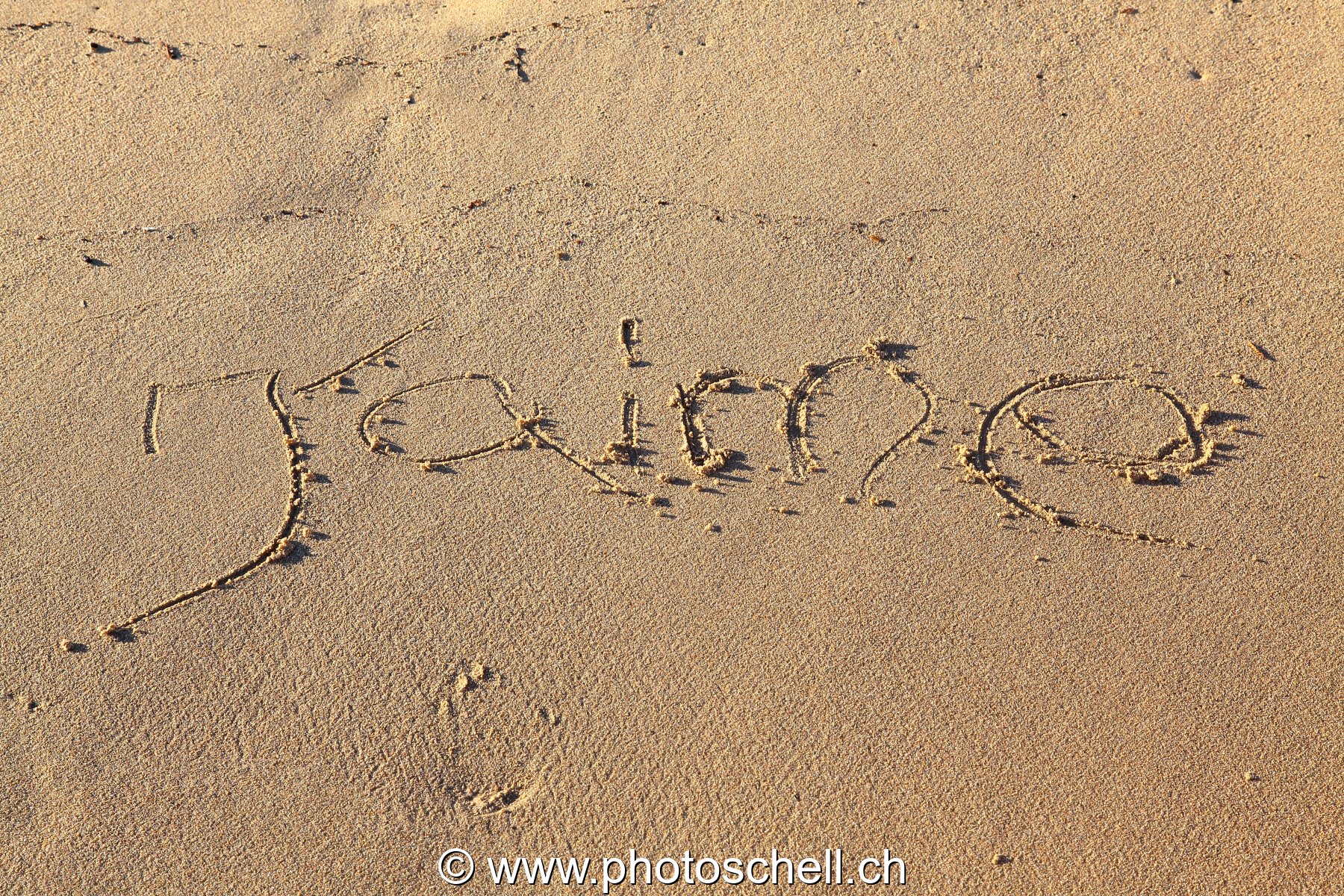 J'aime écrit dans le sable